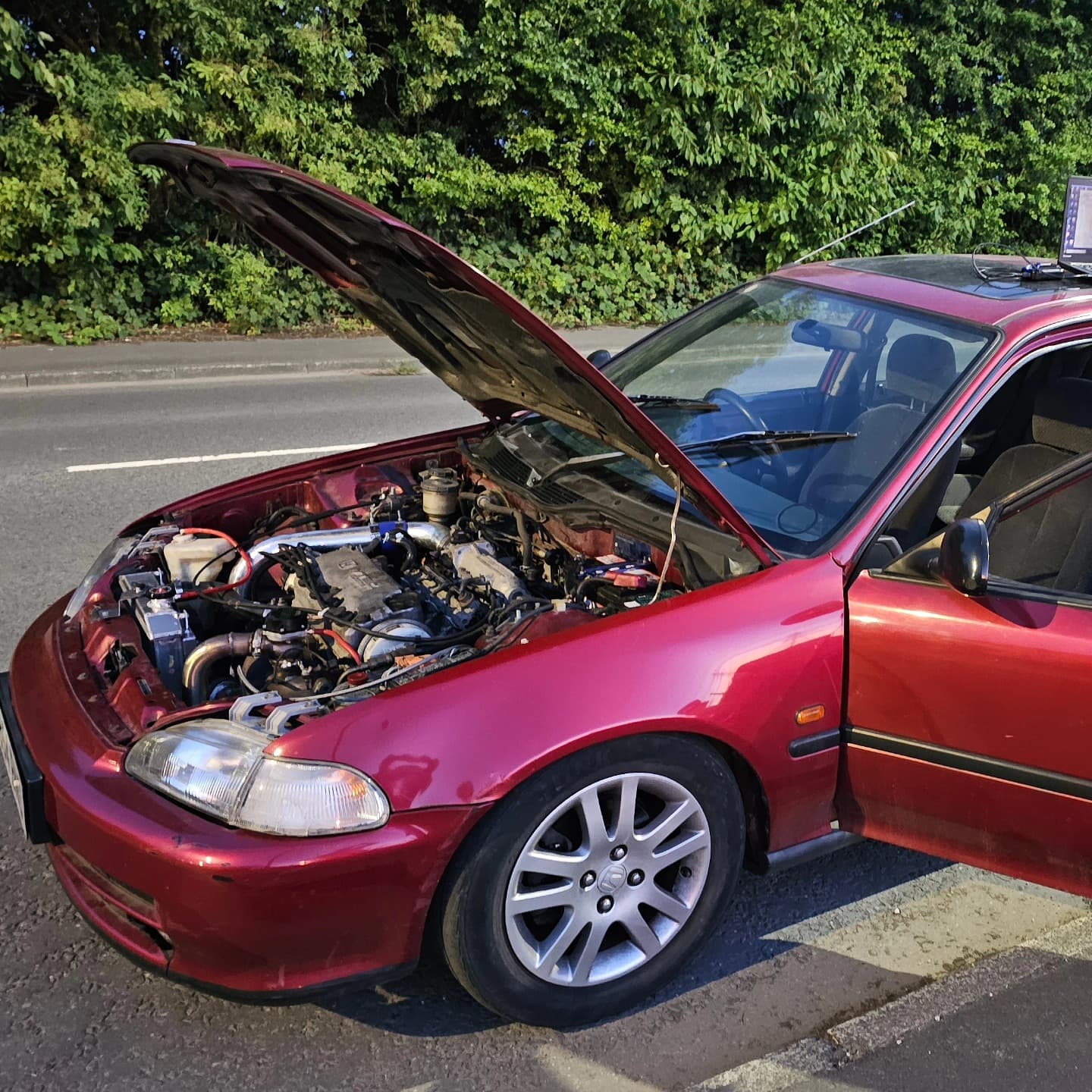 Turbo Honda Civic EG D16 with hood up and laptop mounted for a live road tune